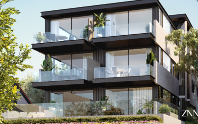 An exterior view of a modern, multi-story residential building featuring dark charcoal metal cladding and expansive glass-fronted balconies. Lush green plants and tropical foliage are integrated into the balcony spaces, set against a clear blue sky.